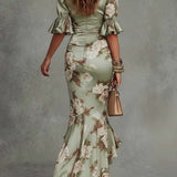Isabella - Asymmetrical long dress in green satin with V-neck, flared puff sleeves, and floral pattern